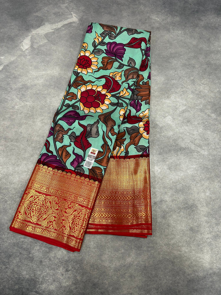 Pure Kanjivaram green silk saree with hand-painted Kalamkari florals and red-gold zari border — Diwali Collection